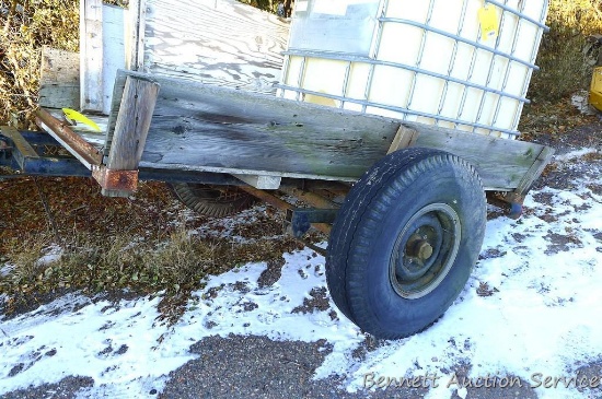 Tilting drop-axel trailer with 4' x 8' bed and two sets of sides. Bring 1-7/8" and 2" hitch balls.