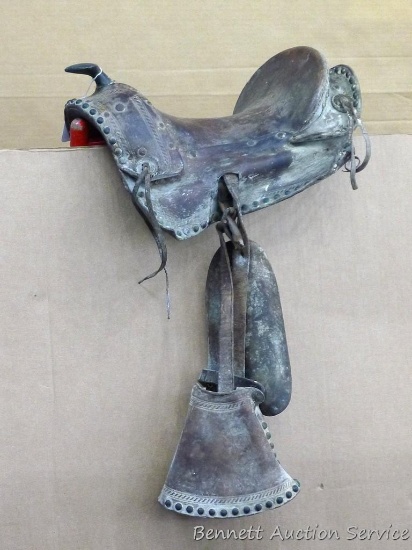 Pony saddle has tack accents and would make a great decoration, or you might be able to revive it