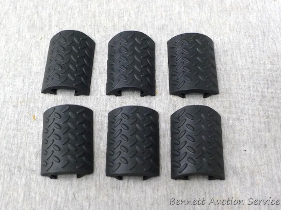 Six hard rubber picatinny rail covers, each approx. 2" long. Unused.