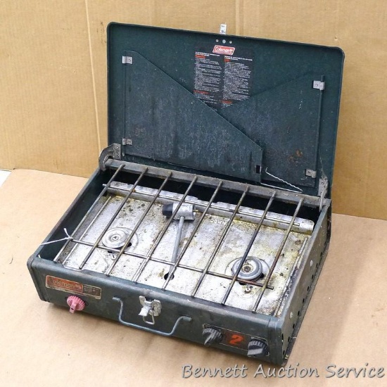 Coleman 2 burner propane camping stove is 18" x 13" x 6" tall, has an igniter that works.