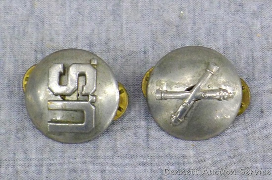 Silver toned US and Field Artillery pins from US military. Both are domed, marked 'New York' on back