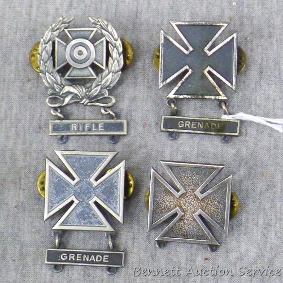 Four US Army Marksmanship Qualification Badges. Expert badge has Rifle clasp, badge is approx.