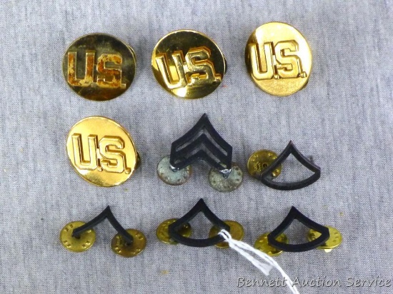 US Military pins including five chevron pins and four US pins.