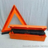 Three reflective emergency warning triangles. Collapsible triangles come with carrying case and are