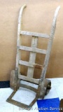 Antique Nutting hand cart has metal rimmed wheels. Stands approx 22