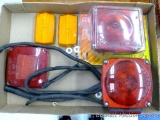 Two stop and turn taillights ( one is NIP), side marker lights, taillight lenses, more.