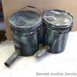 Two 5 gallon gravity pail feeders or similar are painted camouflage.