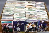 Collection of unsorted football cards.