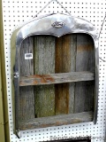 Model A radiator shell has been converted into a hanging barn board shelf. Measures approx 20