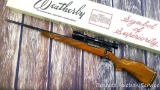 Left handed Weatherby Mark V bolt action rifle in .240 Weatherby Magnum. Comes with a 3-12x40 scope