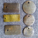 Wisconsin trap tags 1927, 1929, 1935, 1937 to 1940.