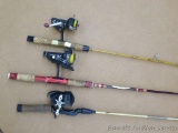 Three fishing rods and reels include Berkley rod with an Abu Garcia reel, Garcia rod with a D-A-M