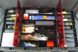 Plano folding tackle box holds lures, fishing line, more. Box is about 15