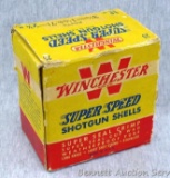 Winchester Super Speed 16 gauge shotgun shells in a vintage box. One tab of box is torn off, one