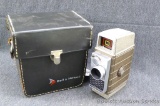 Bell & Howell hand held video camera and case. Camera winds and holds, shutter release lever cycles