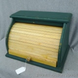 Tambour bread box or appliance garage is a foot and a half wide. Solid wood and press board