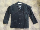 Ladies Minnetonka lined leather jacket with fringe and buffalo nickel buttons. Good condition with