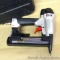 Porter Cable pneumatic crown narrow stapler NS150C. Comes with extra staples, instructions and carry