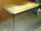 Sturdy formica topped work table is 5' x 2-1/2'. Has a steel frame and is 29