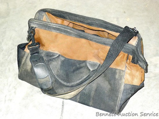 Canvas tool organizer bag has pockets and is about 18" x 8" x 9" tall. Has inner and outer pockets,