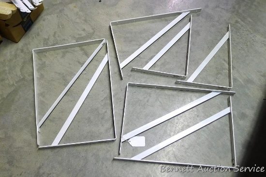 Seven metal shelf brackets, largest is 13" x 18". In new condition.