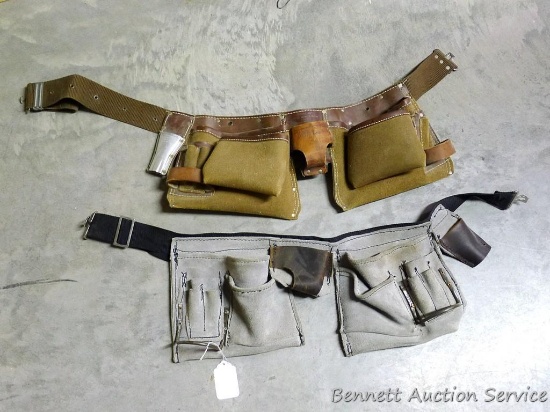 Two carpenter or electrician's belts, one leather, one cloth. Both are in nice shape.