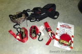 Assortment of ratchet straps of different widths and lengths.