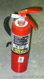 No shipping. Ansul Sentry fire extinguisher is charged and ready to go.