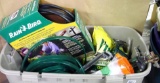 Large tote of yard and garden supplies including Rain Bird drip kit, sprinklers, vegetable