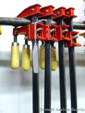 Four screw-type ratcheting clamps are approx. 22