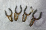 Four unique horse shoe hooks. Shoes are 3-1/2