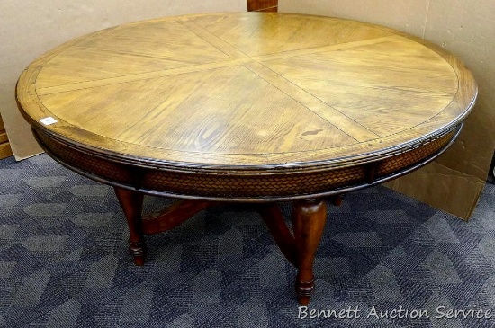 Pretty dining table is in good condition and quite sturdy. Table measures 30" high x 60" diameter.