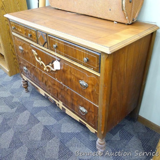 Antique four drawer dresser, 20" x 46" x 34". Veneer is peeling. Ready for restoration.