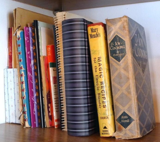 Variety of vintage cookbooks. The Joy of Cooking, 1943; Mary Meade's Magic Recipes; some church