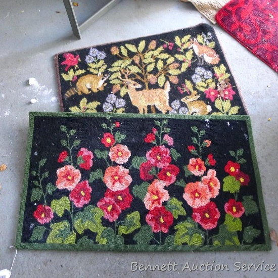 Two flowered throw rugs. Largest is 42" x 24". Need a good cleaning.