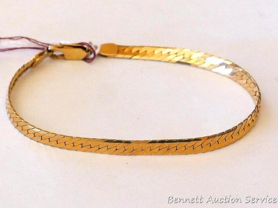 Nice bracelet is marked 14K and A on the loops on the ends of the chain. Weighs 10.2 grams and is 8"