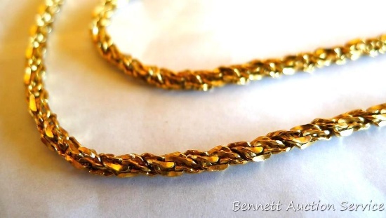 Twisted chain necklace is marked 14KT Italy and weighs 25.3 grams. Measures 14" long when clasped.