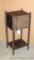 Cute little homemade cabinet is reminiscent of a smoking stand. A look inside shows wood was used