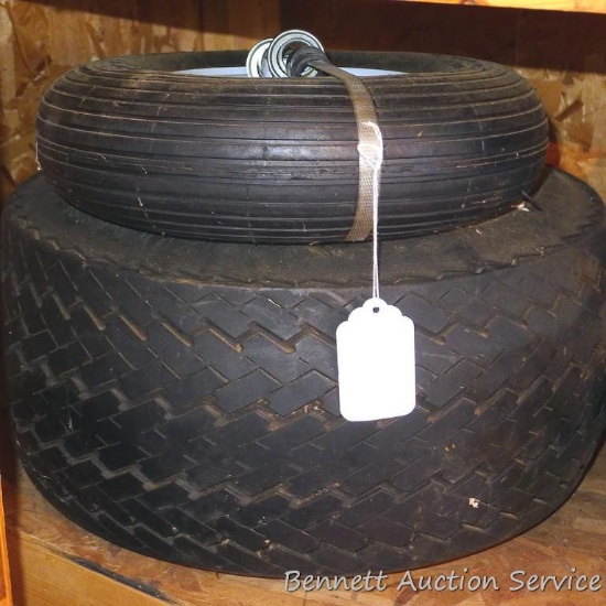 New front tire for wheelbarrow with heavy duty ball bearings; spare snowmobile trailer tire.