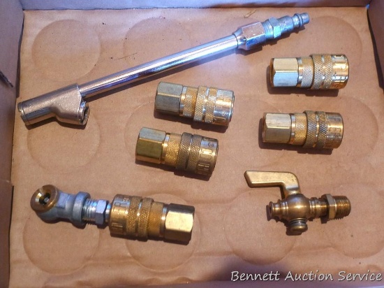 Two tire chucks, five air fittings, drain petcock.