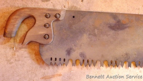 Single man cross cut saw is nearly 6' long.