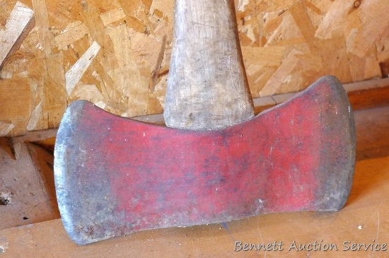 Double bit axe is marked C38. 35" handle is tight.