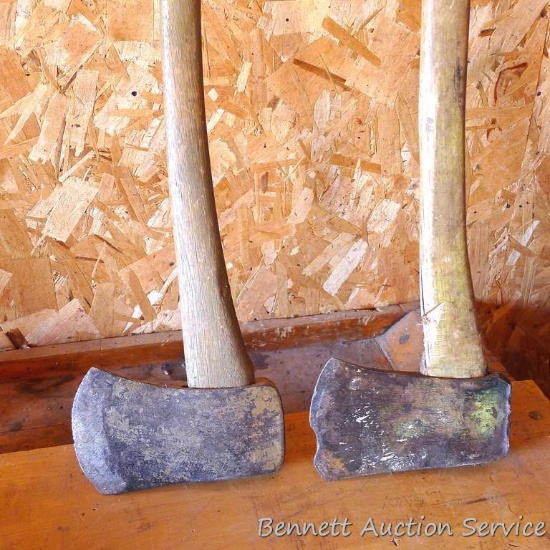 Two single bit axes, handles are tight. One is notably chipped.