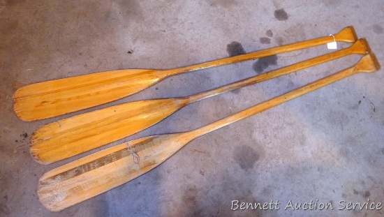 Three wooden canoe paddles in good shape, each 5'.