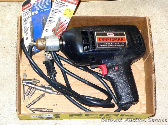 Craftsman 3/8" variable speed reversible drill, plus some bits.