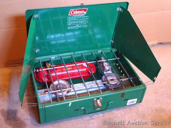 Coleman 425E twin burner camp stove shows little use. 18" across.
