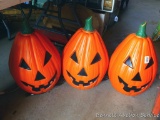 Three lighted plastic pumpkins 22