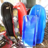 Four plastic sleds 50
