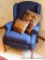 Comfortable reclining wing back chair with two throw pillows. Chair is in good shape, reclines as it