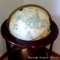 Cram's Imperial World globe with magazine or book holder incorporated into stand. 38